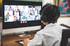 Woman working at home having a video conference with colleagues