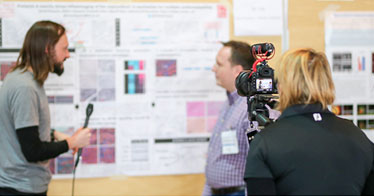 Interviewing poster participants