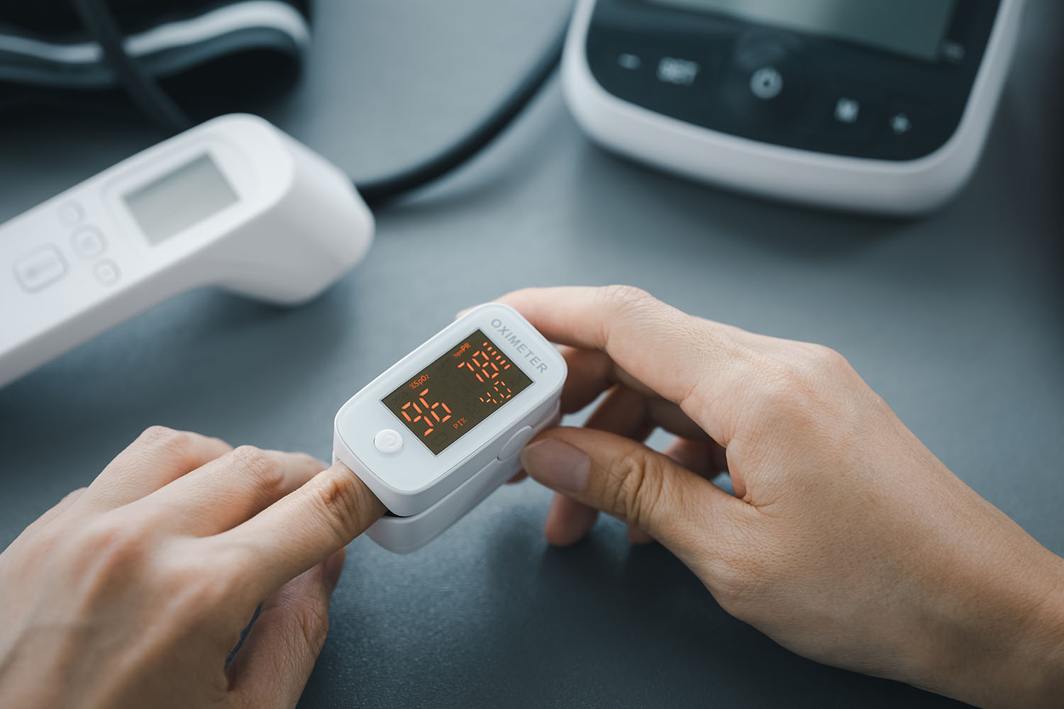 Closeup,Woman,Hand,Self,Monitoring,On,Pulse,Oximeter,,Healthcare,Concept